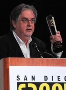 Matt Groening holding award